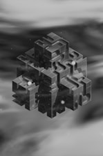 A black and white photo of an object floating in the air