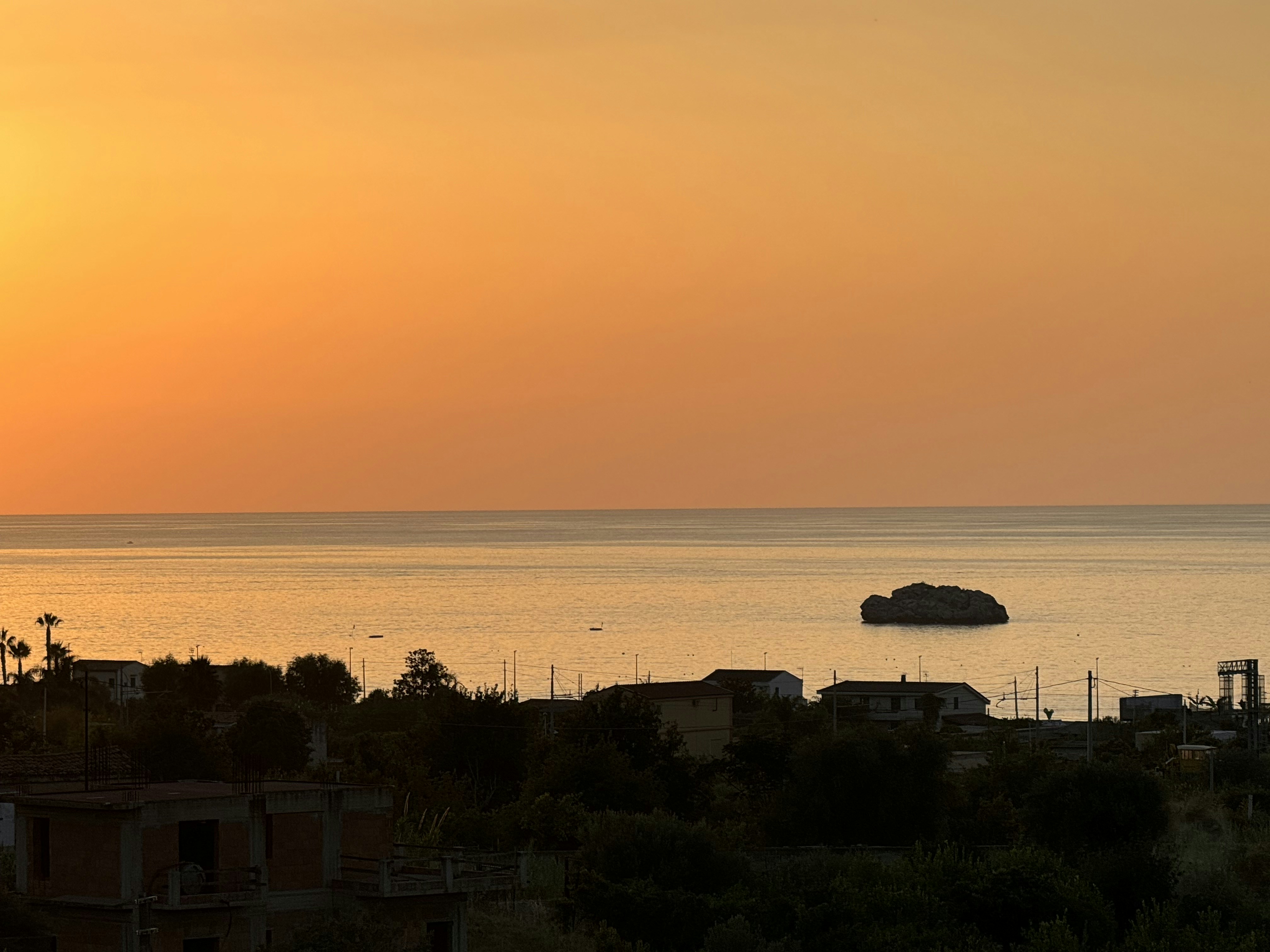The sun is setting over a body of water