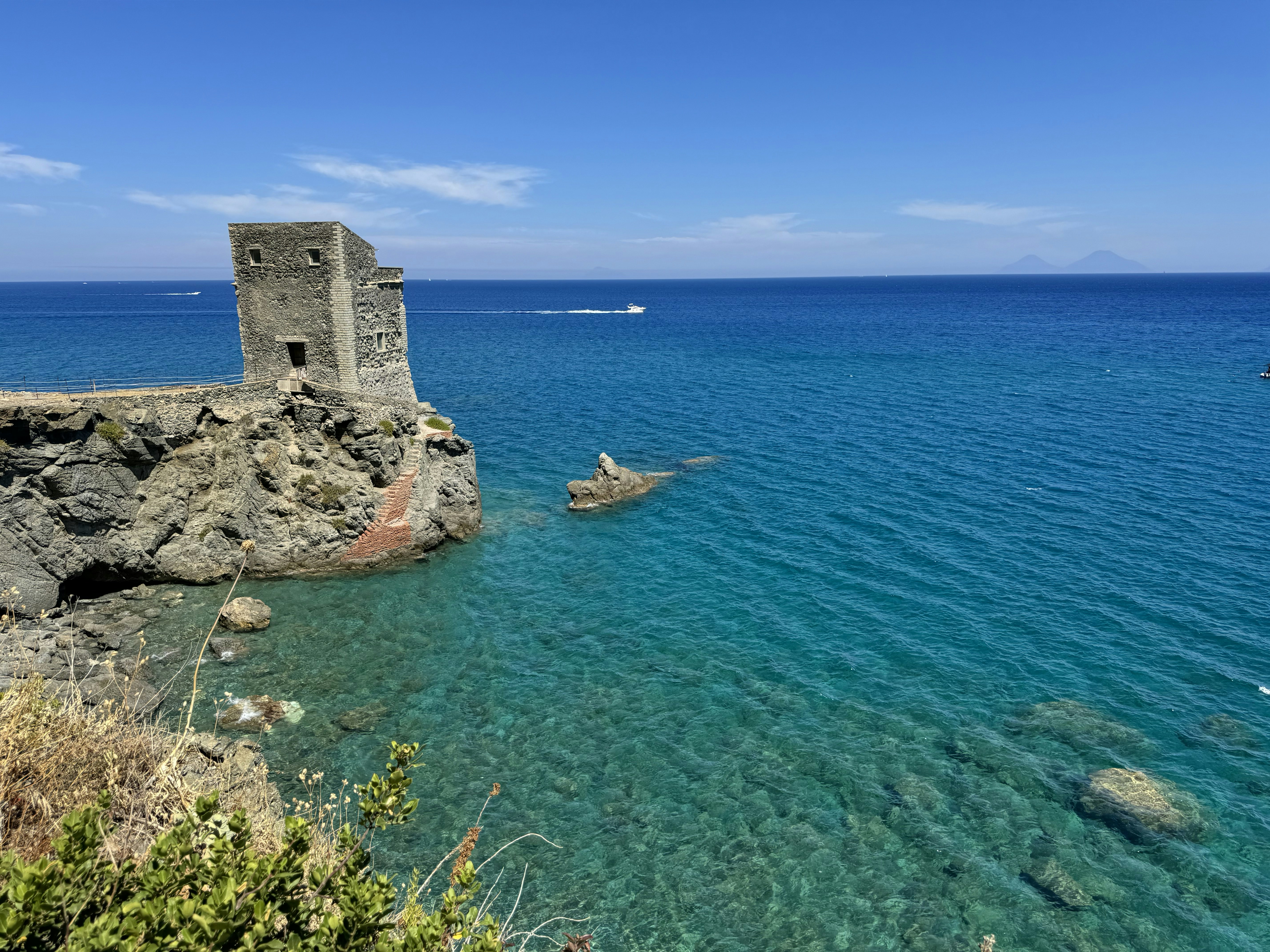 A body of water with a castle in the middle of it