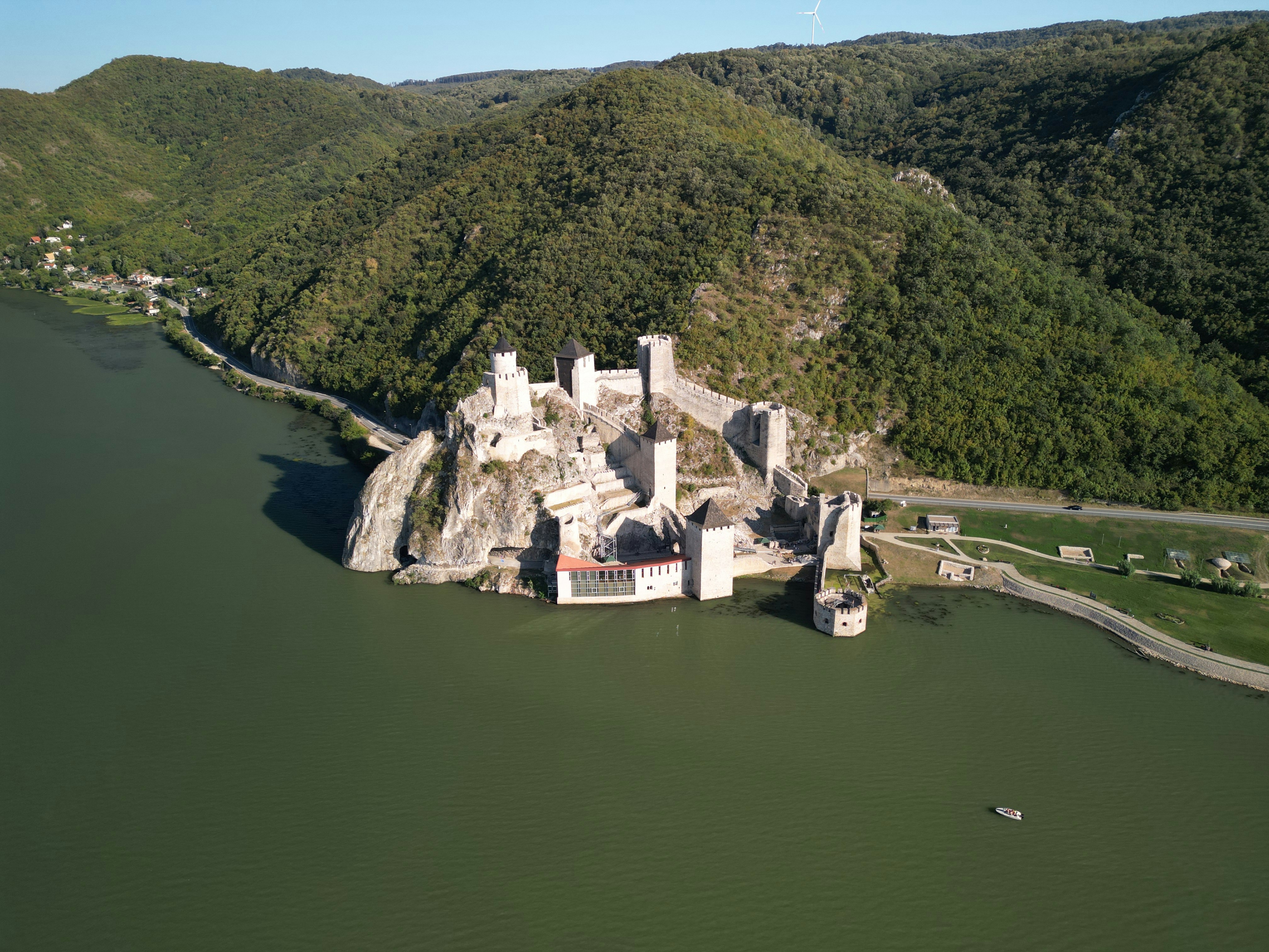 An aerial view of a castle in the middle of a lake