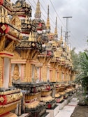 A row of ornately decorated buildings on the side of a road