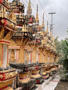 A row of ornately decorated buildings on the side of a road