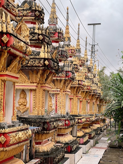 A row of ornately decorated buildings on the side of a road