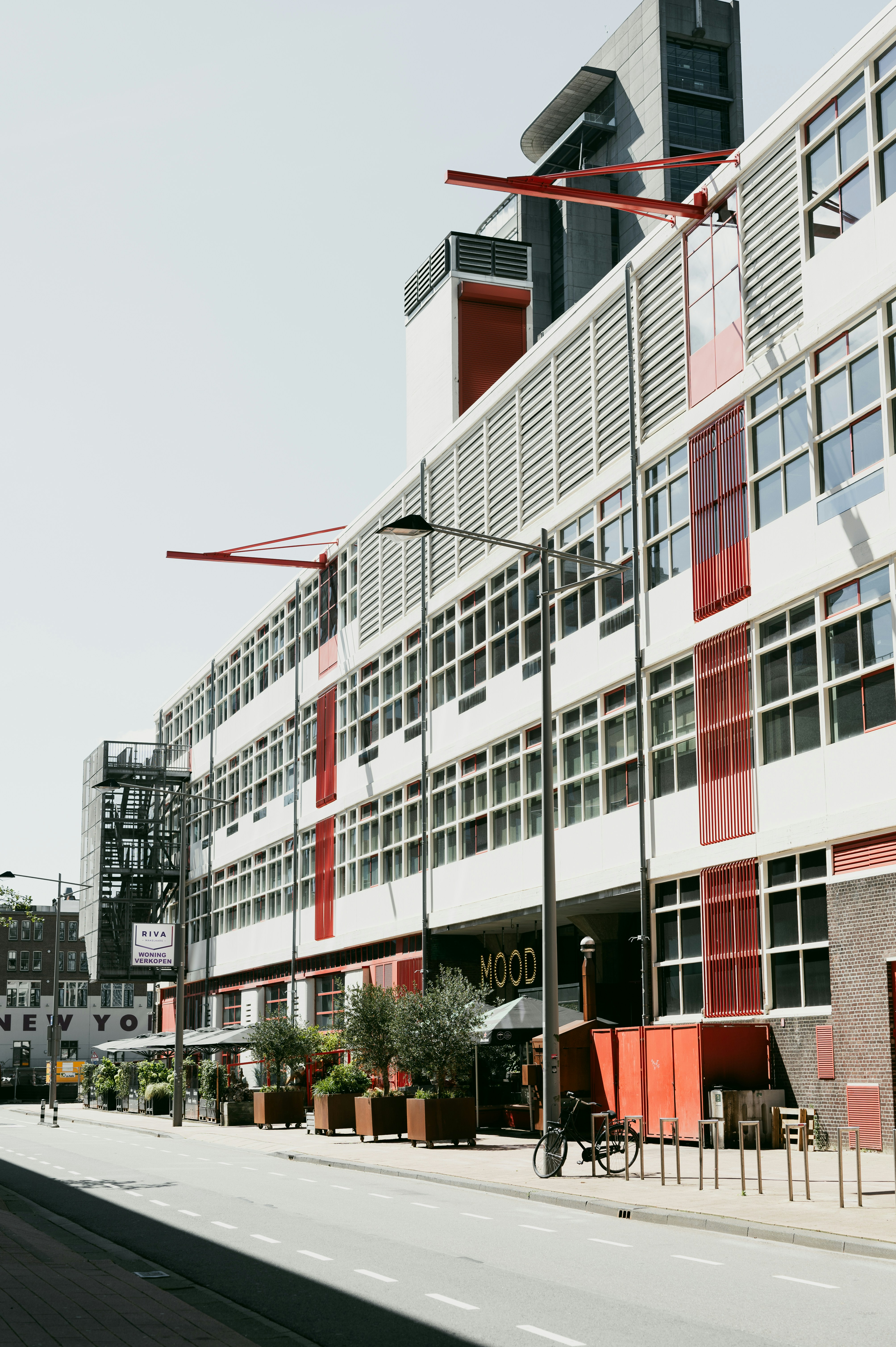 A large building with many windows on the side of it