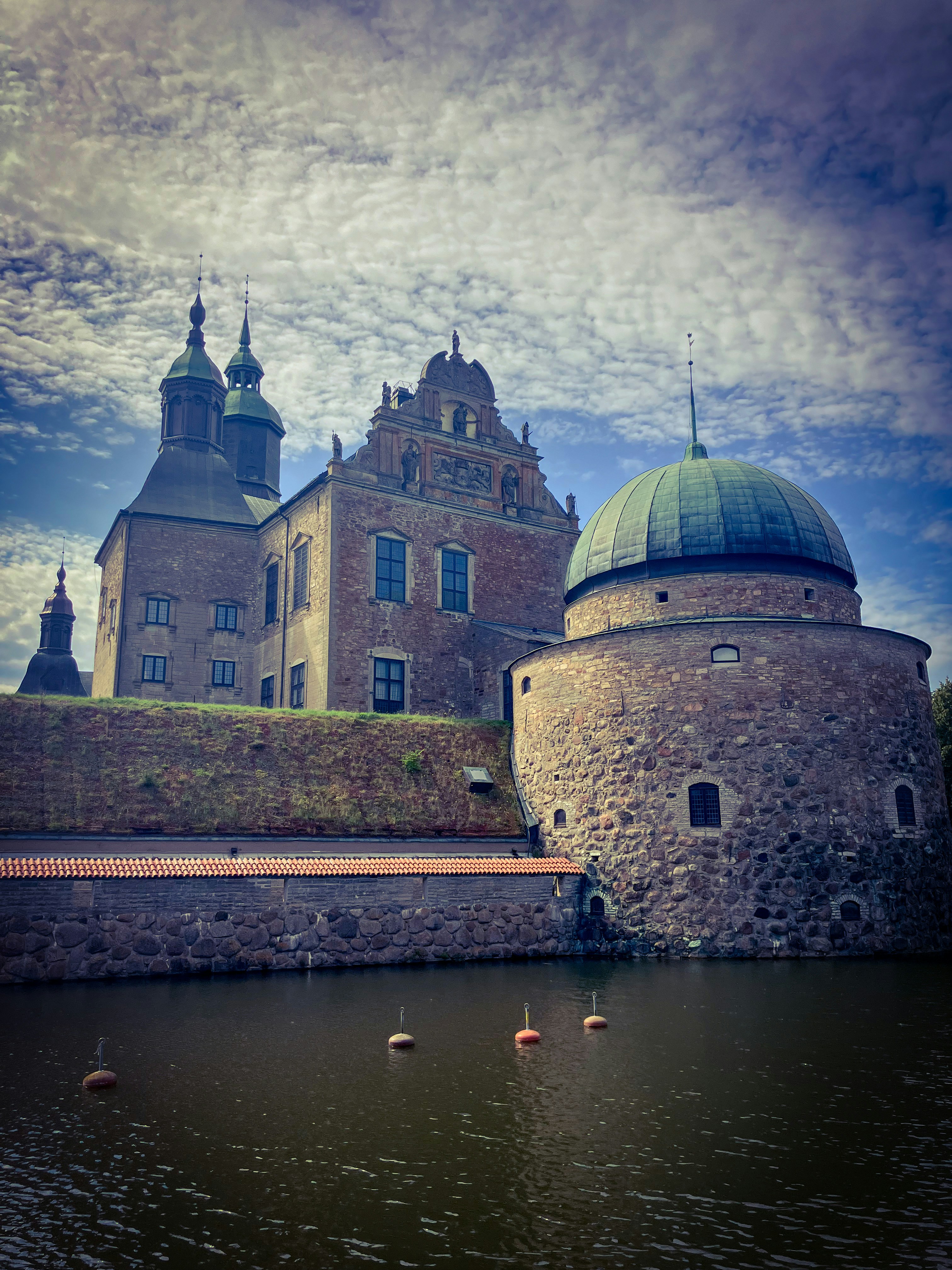 A large building sitting next to a body of water