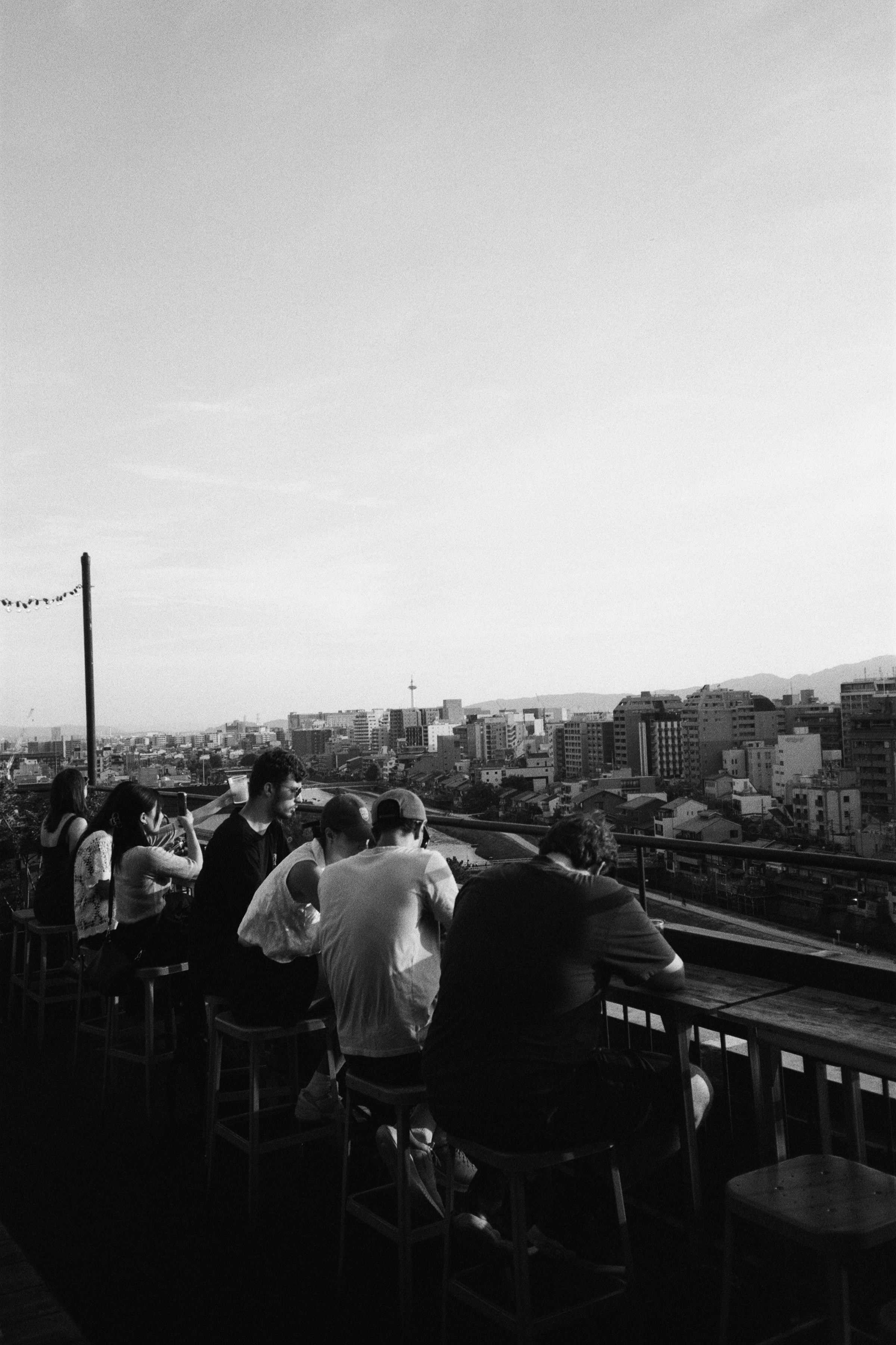A group of people sitting on top of a roof