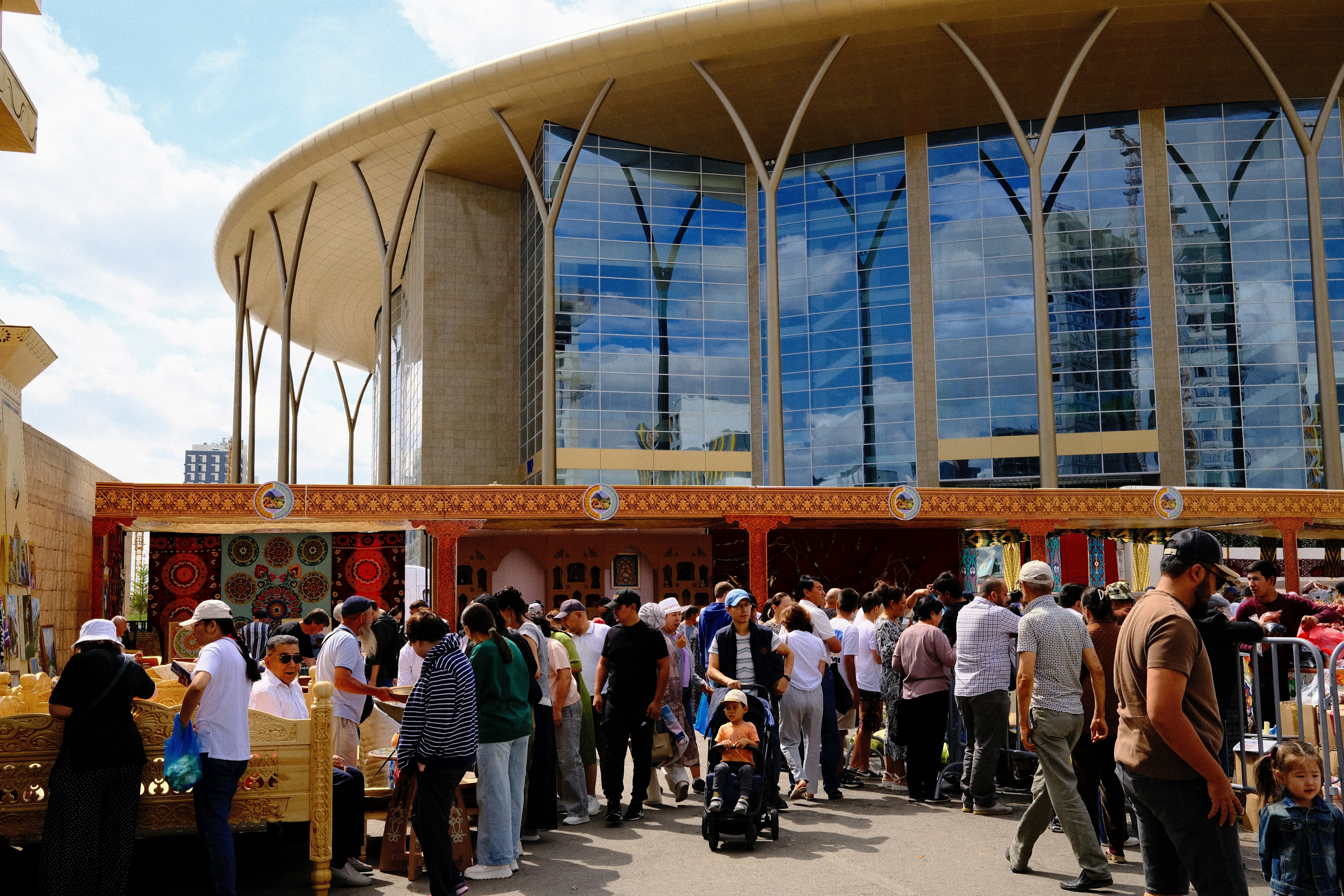 A group of people standing outside of a building