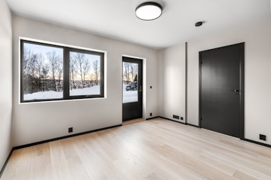An empty room with a lot of windows