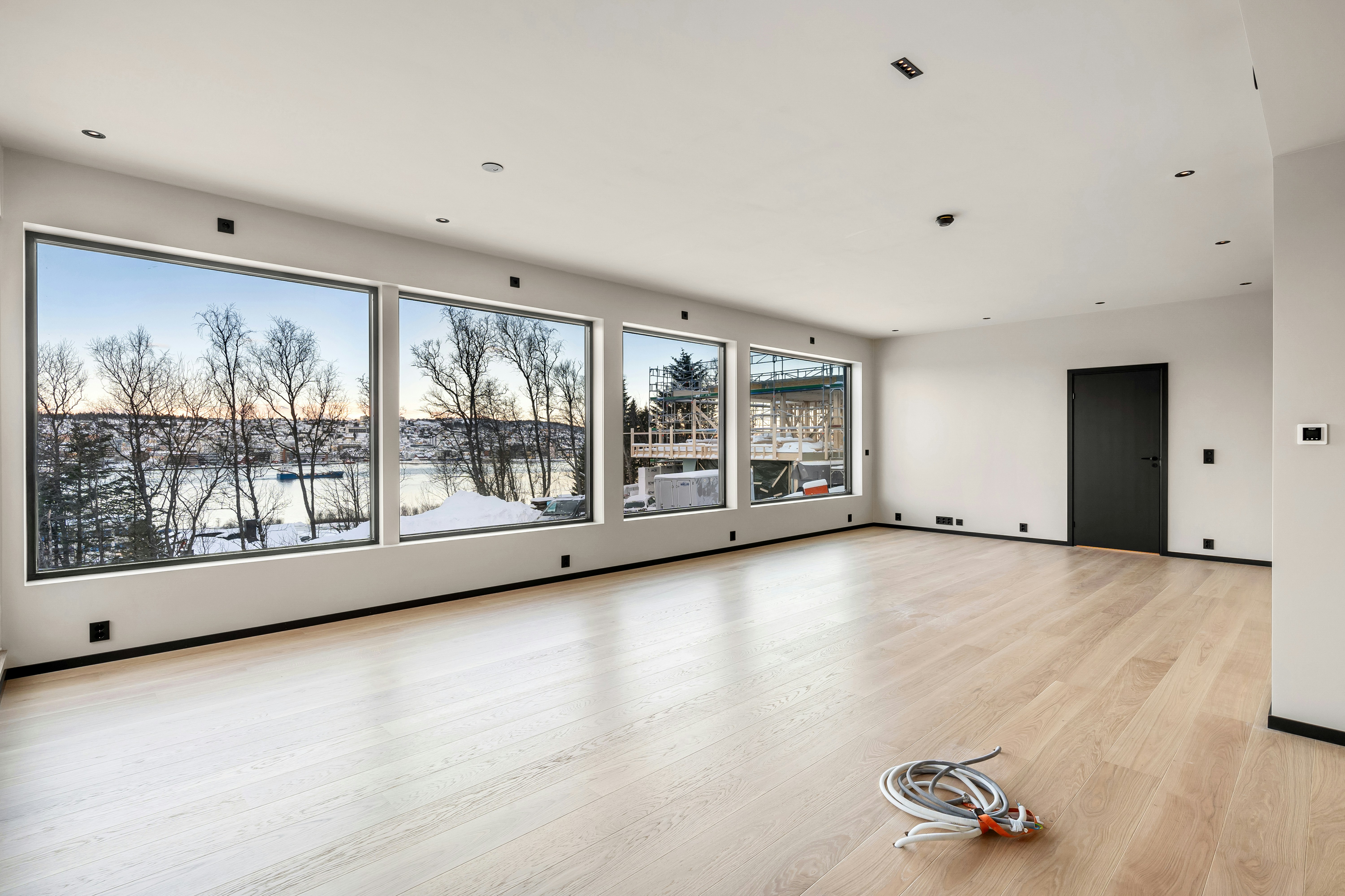 Long empty room with wide windows
