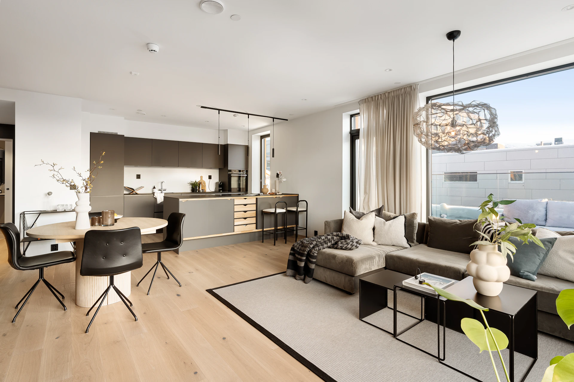 A living room filled with furniture and a large window