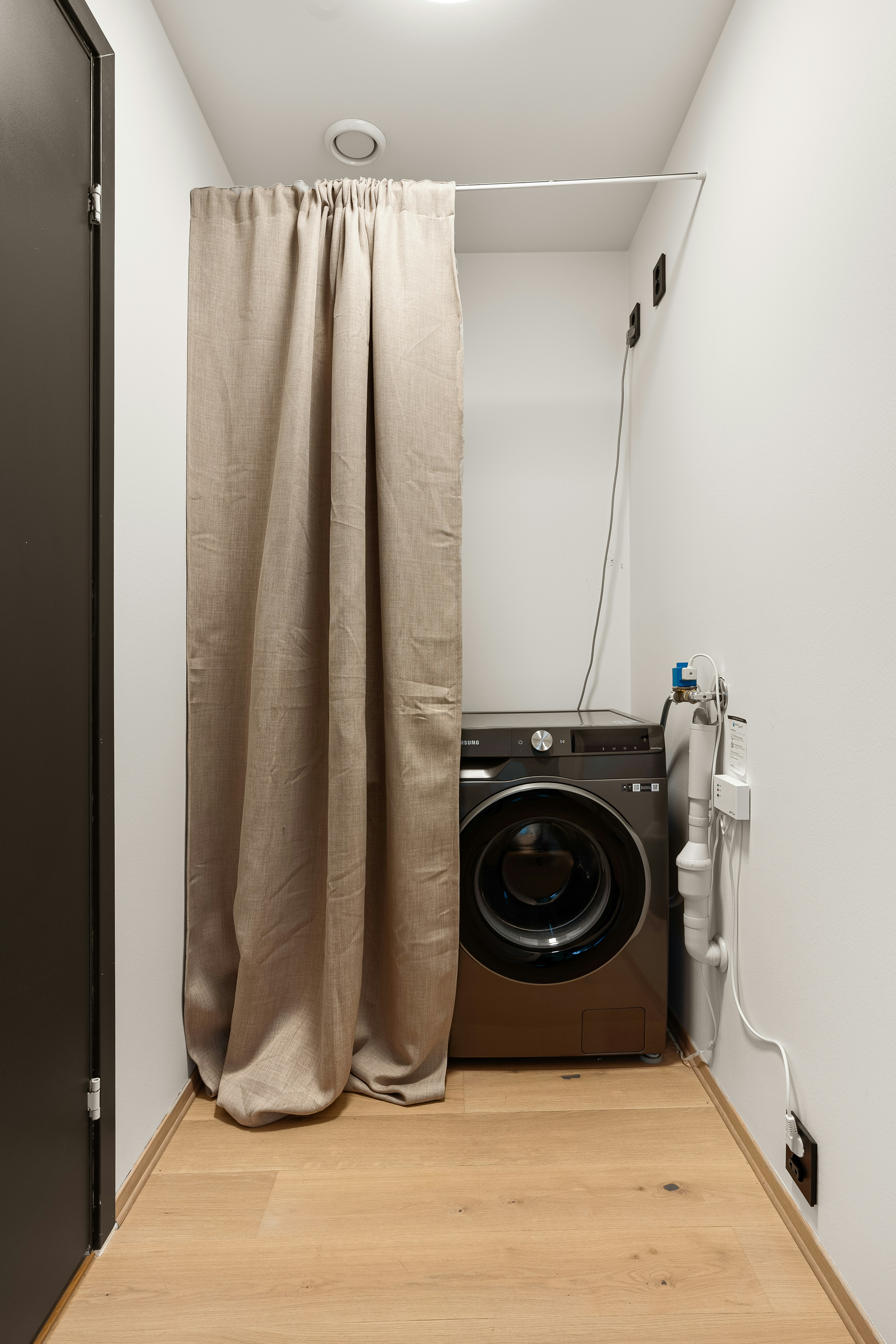 A washer and dryer in a small room