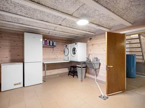A laundry room with a washer and dryer
