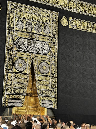 A group of people standing around a large building