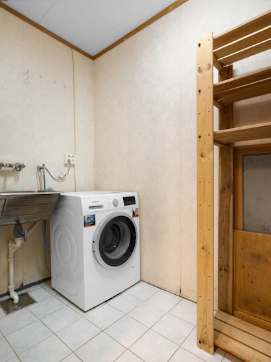 A washer and dryer in a small room