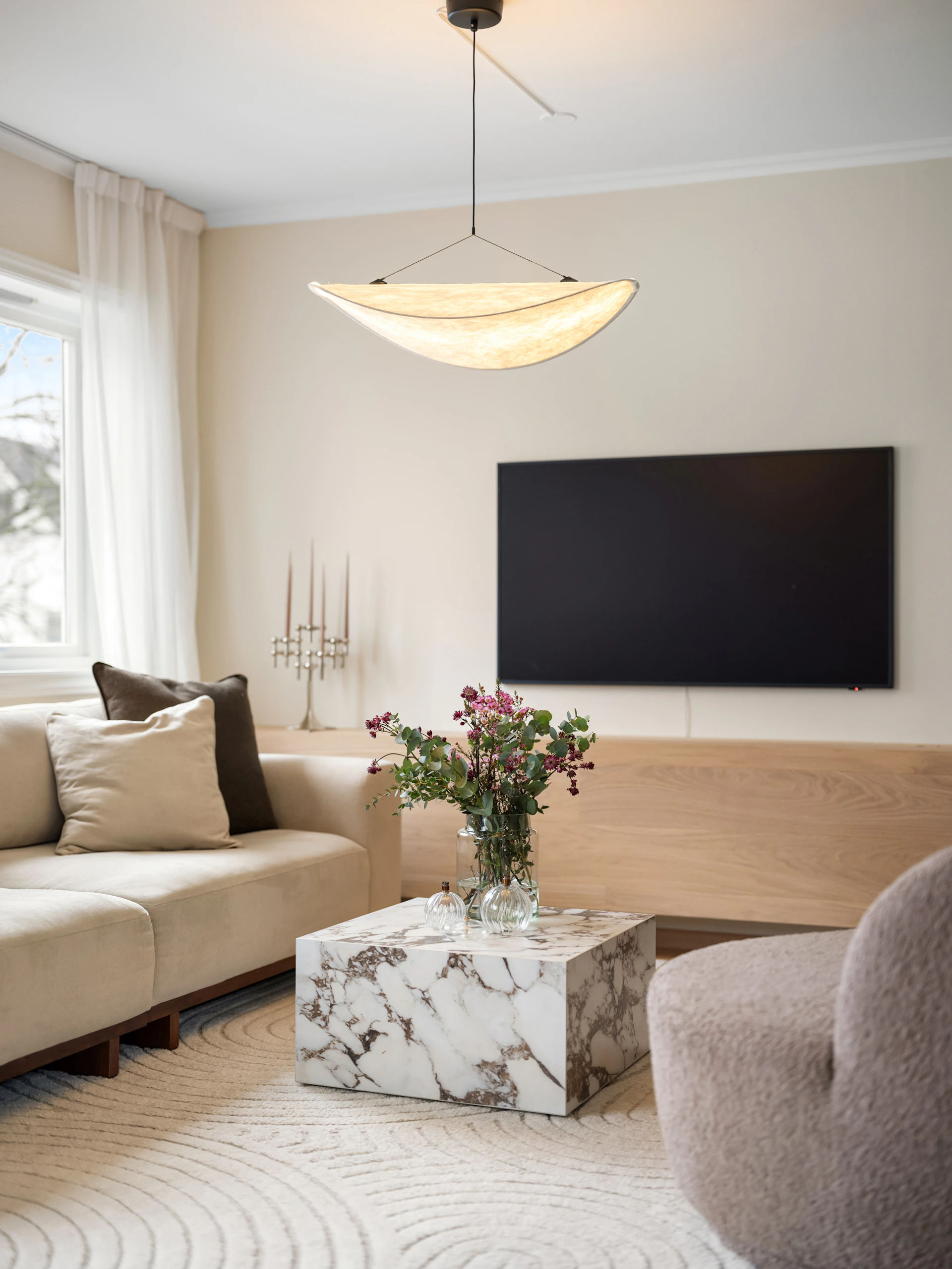 A living room filled with furniture and a flat screen TV