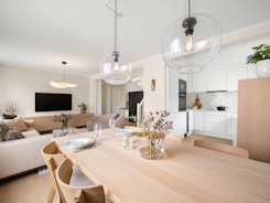 A dining room table with chairs and a couch