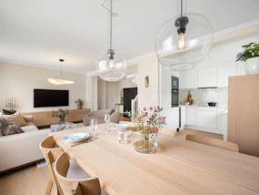 A dining room table with chairs and a couch