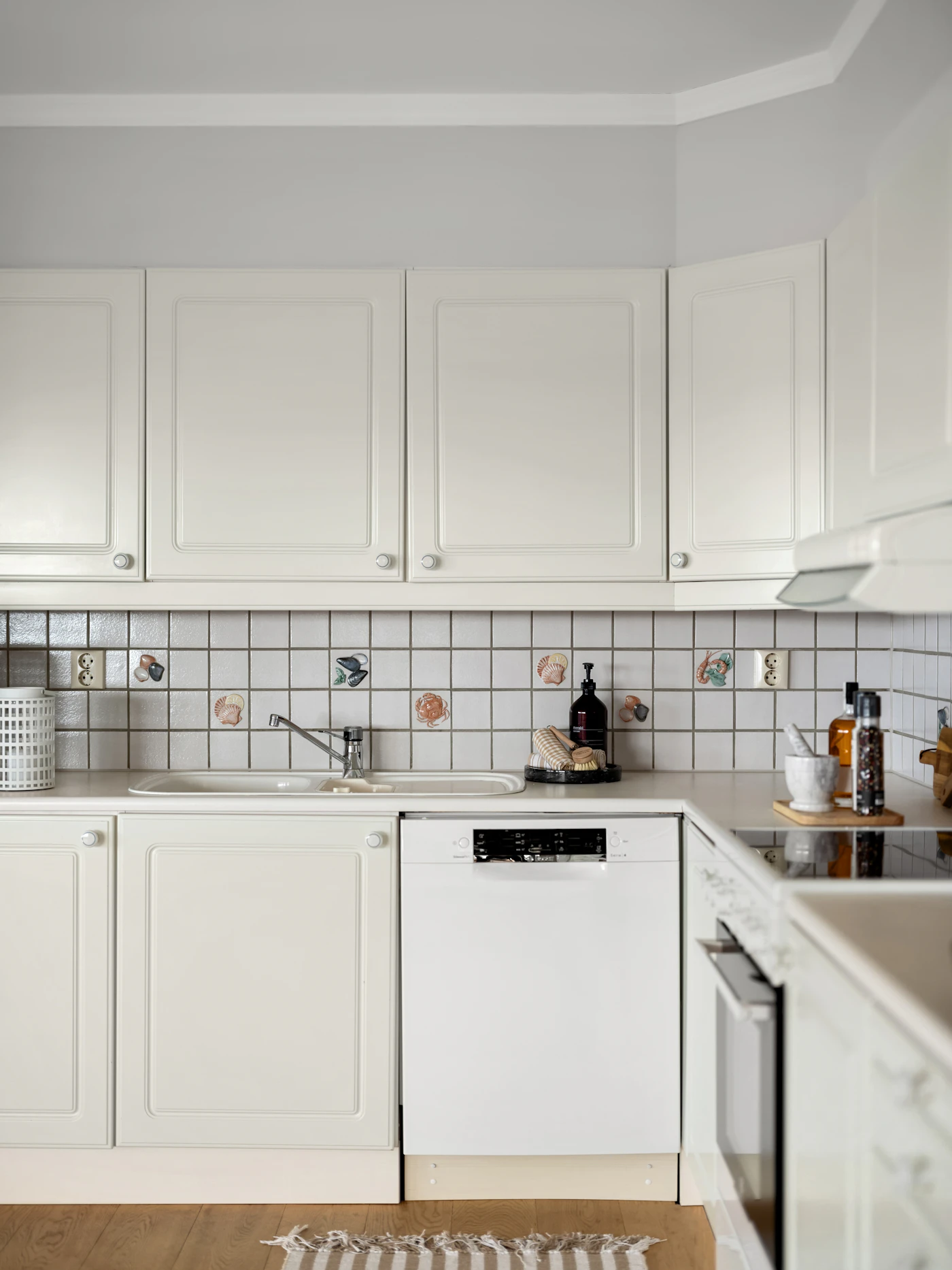 Kitchen with white cabinets and a dishwasher