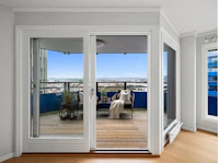 A living room with a large sliding glass door