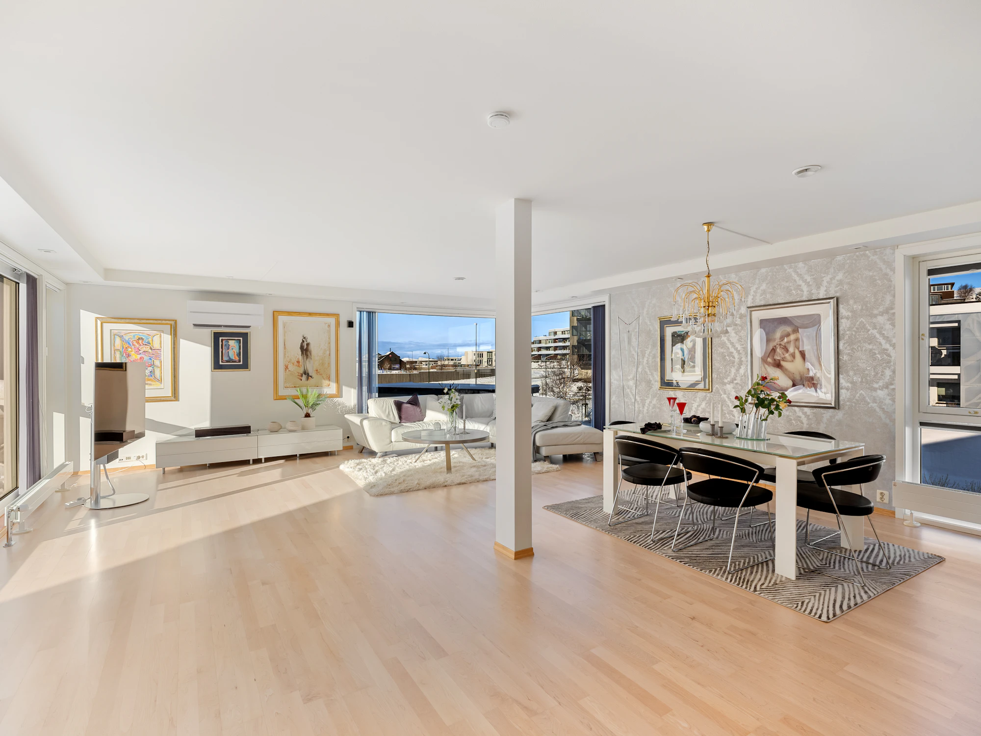 Open living room with warm hardwood flooring