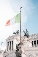 A flag flying in front of a building