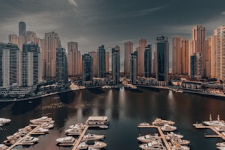 A harbor filled with lots of boats under a cloudy sky