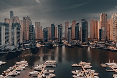 A harbor filled with lots of boats under a cloudy sky