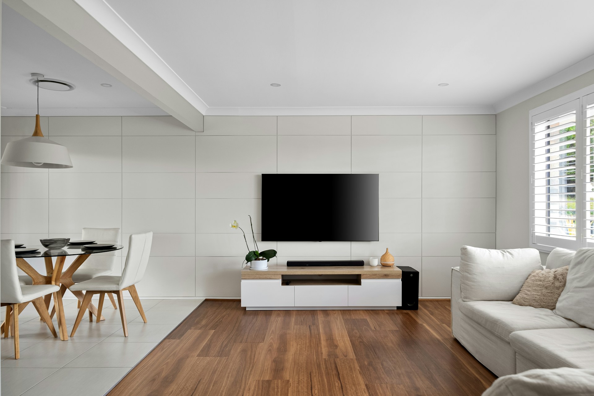 A living room filled with furniture and a flat screen TV