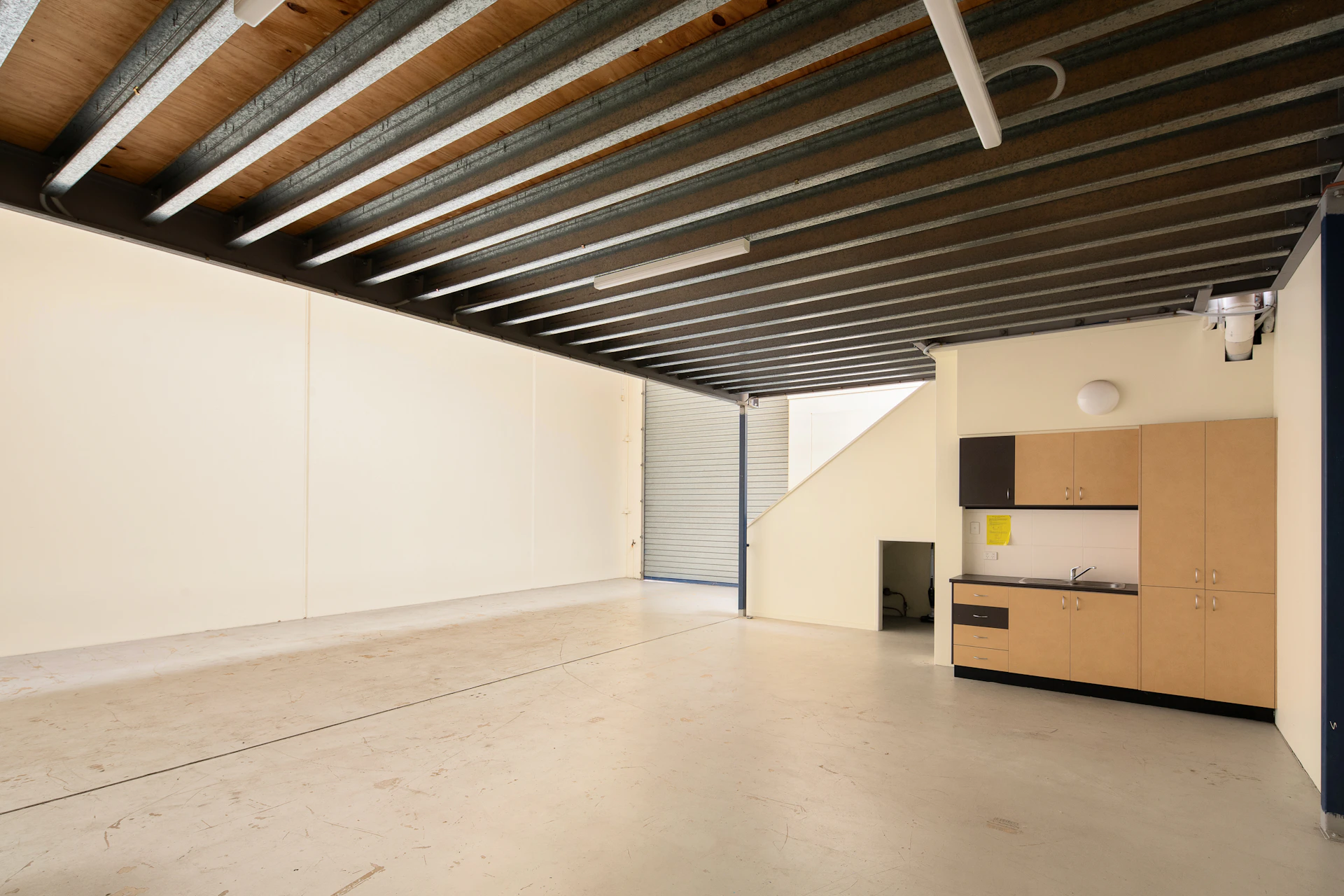 An empty room with a bed in it