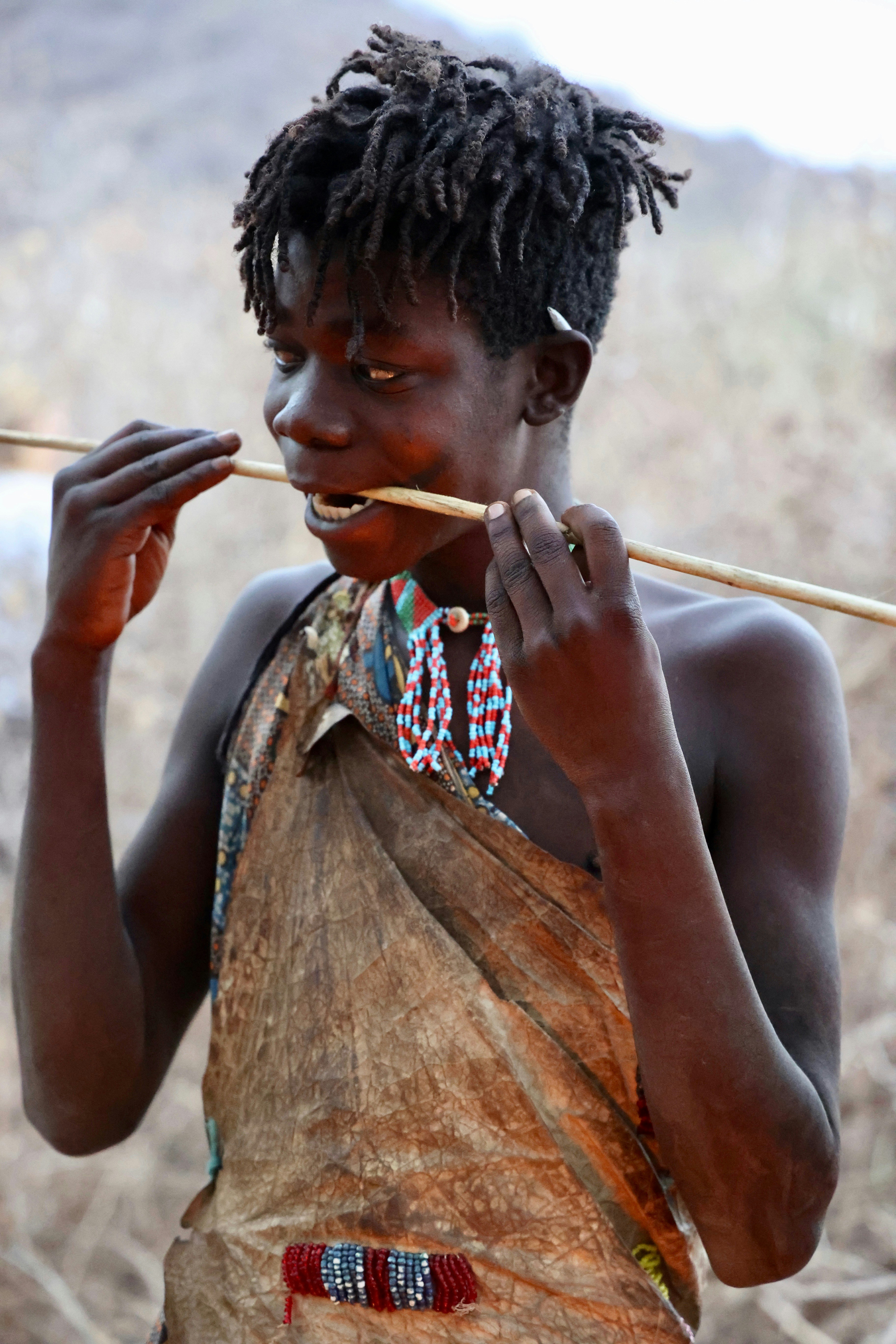 A woman with a stick in her hand