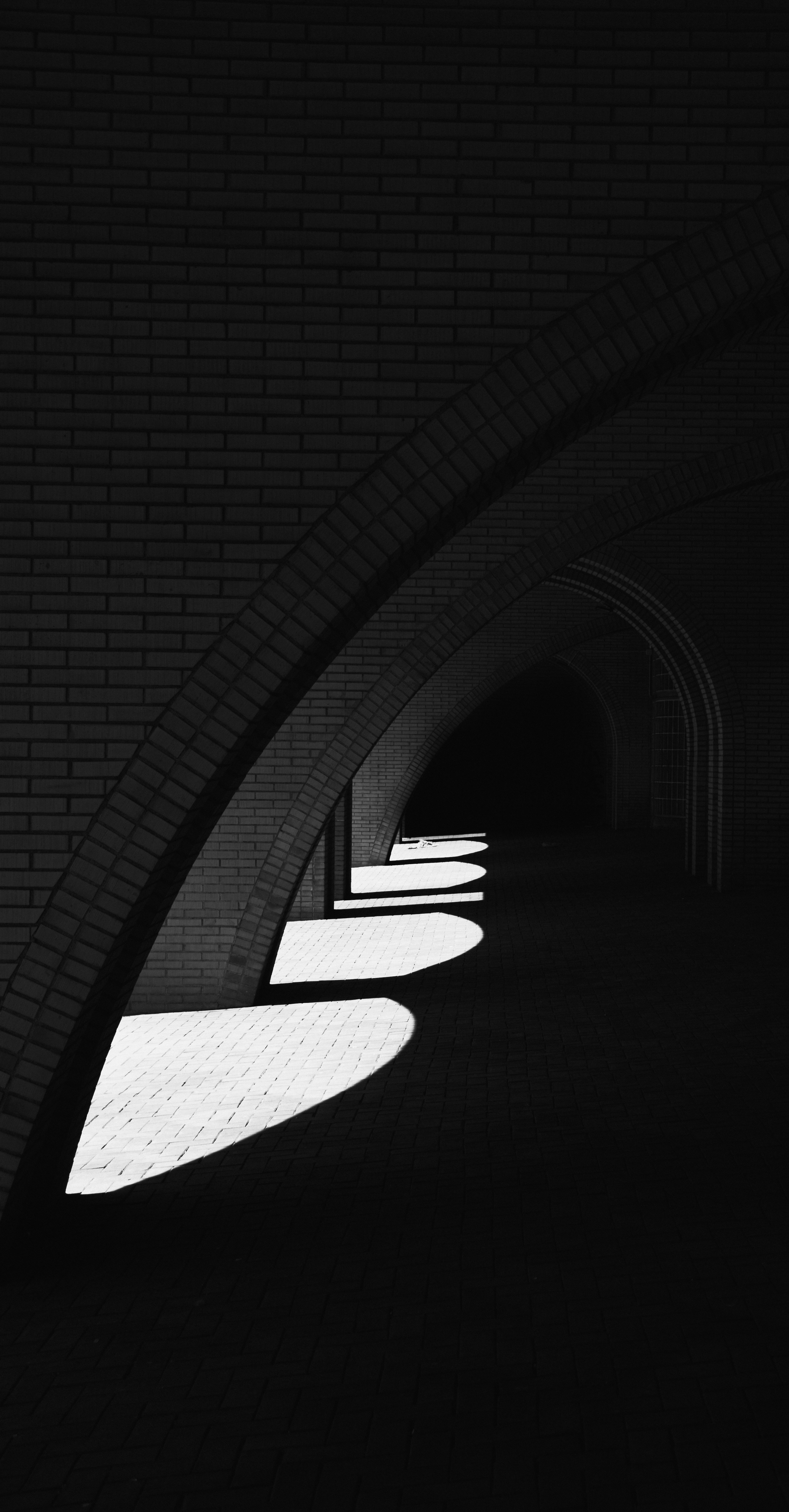 A black and white photo of a tunnel
