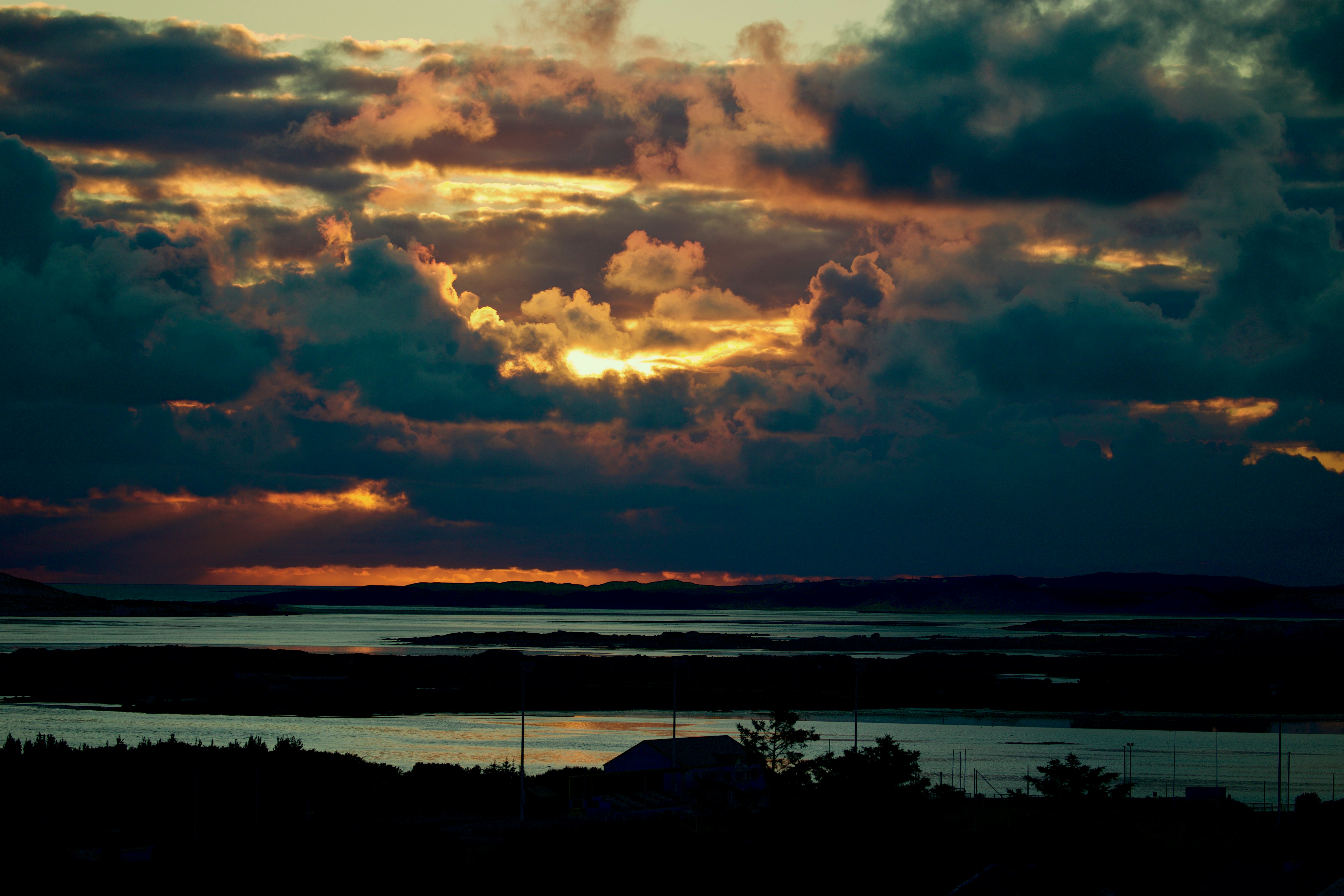 The sun is setting over a body of water