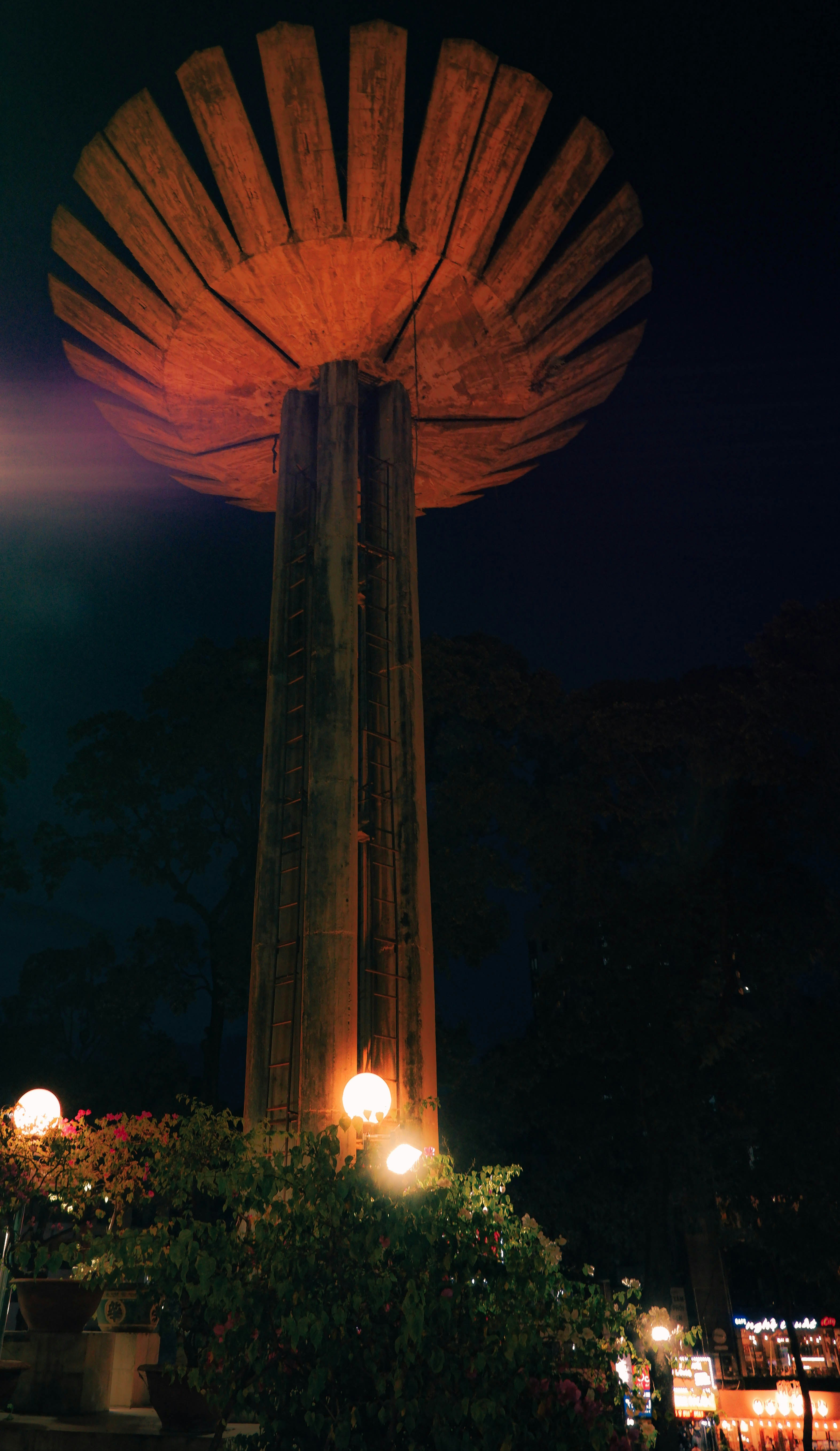 A tall tower with a light on top of it