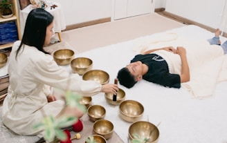 A couple of people that are laying on a bed