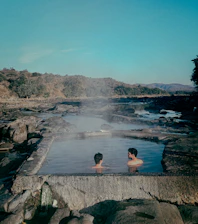 A couple of people that are in some water