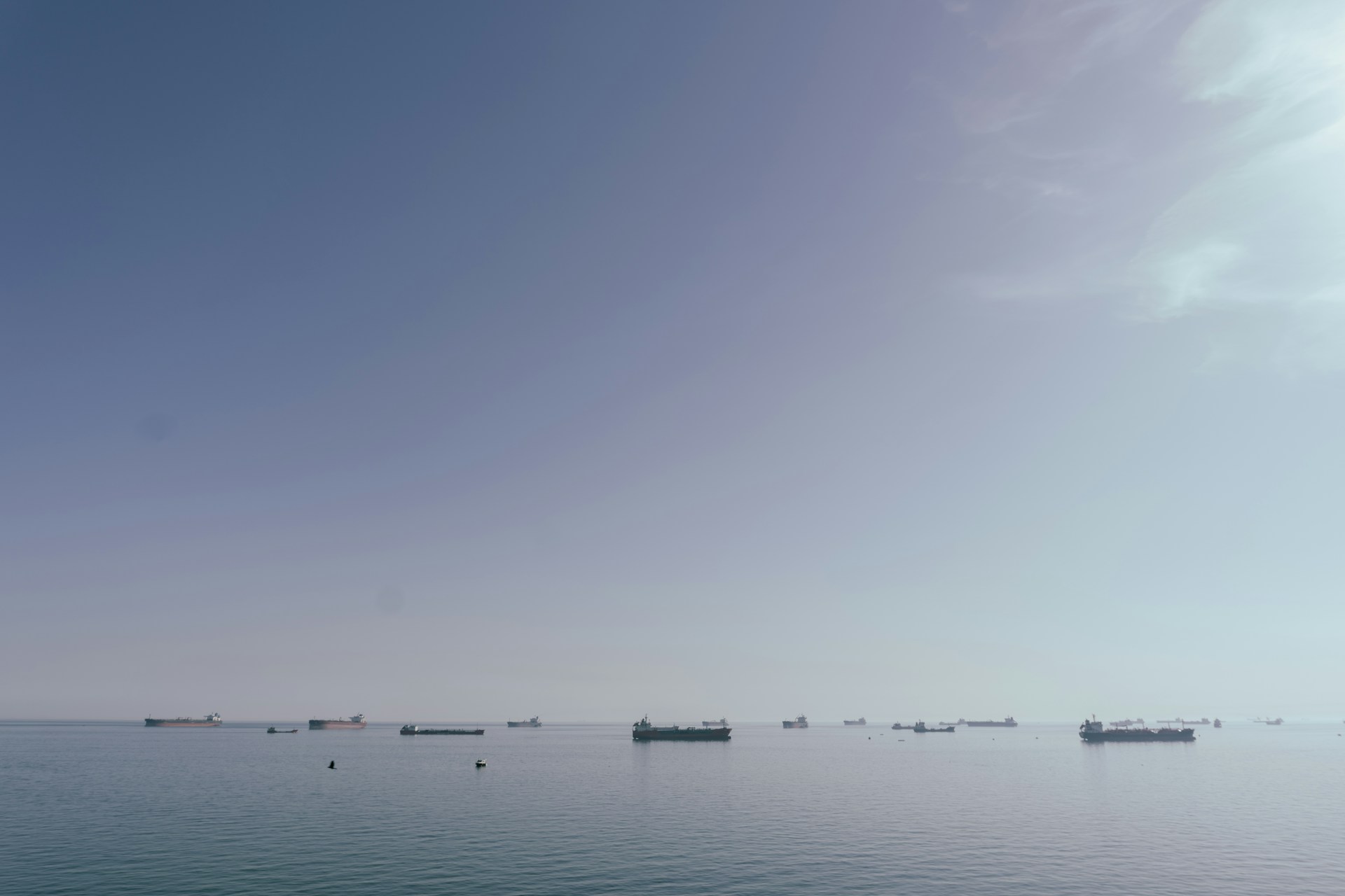 A large body of water with boats in the distance