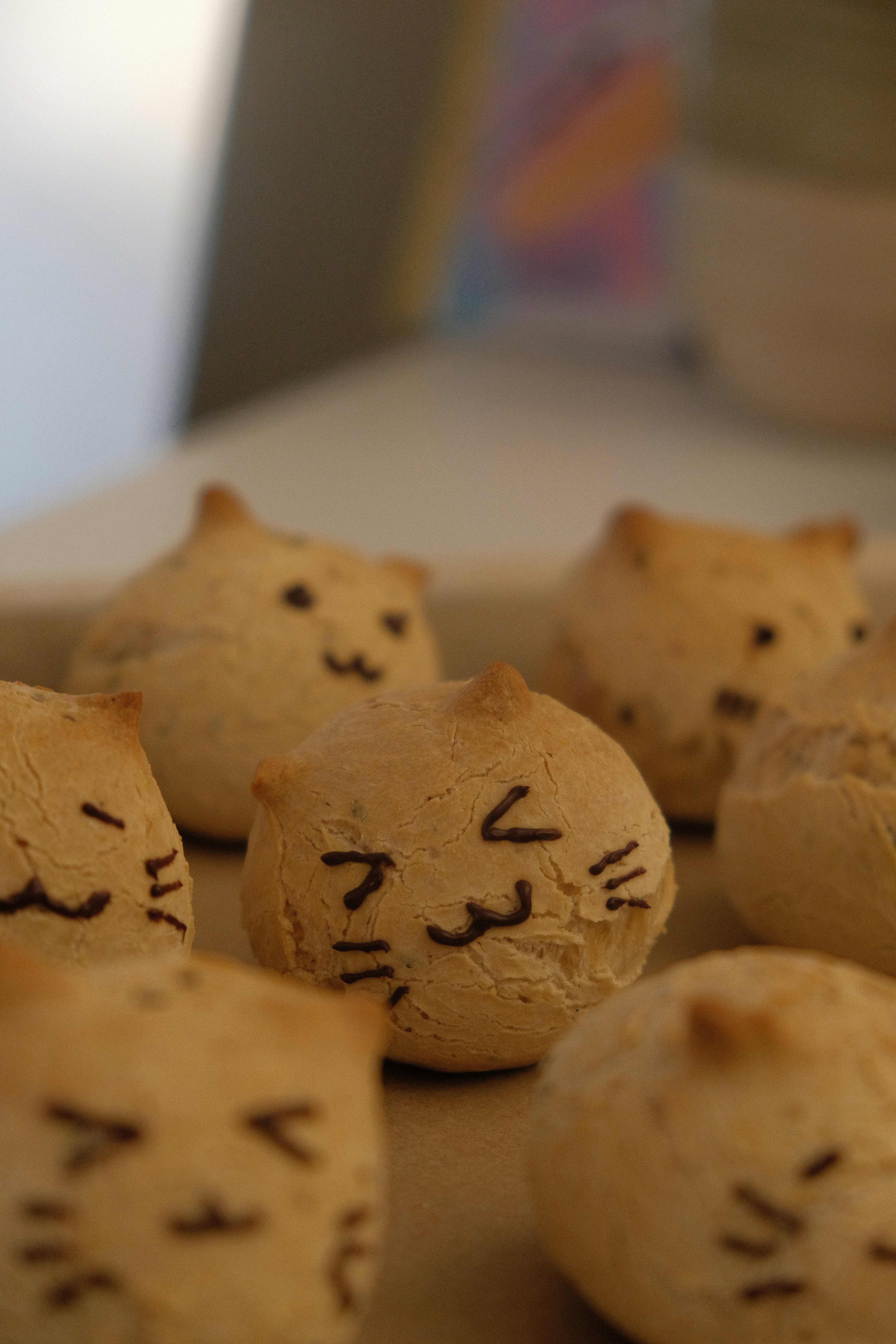 A close up of a bunch of cookies with faces on them
