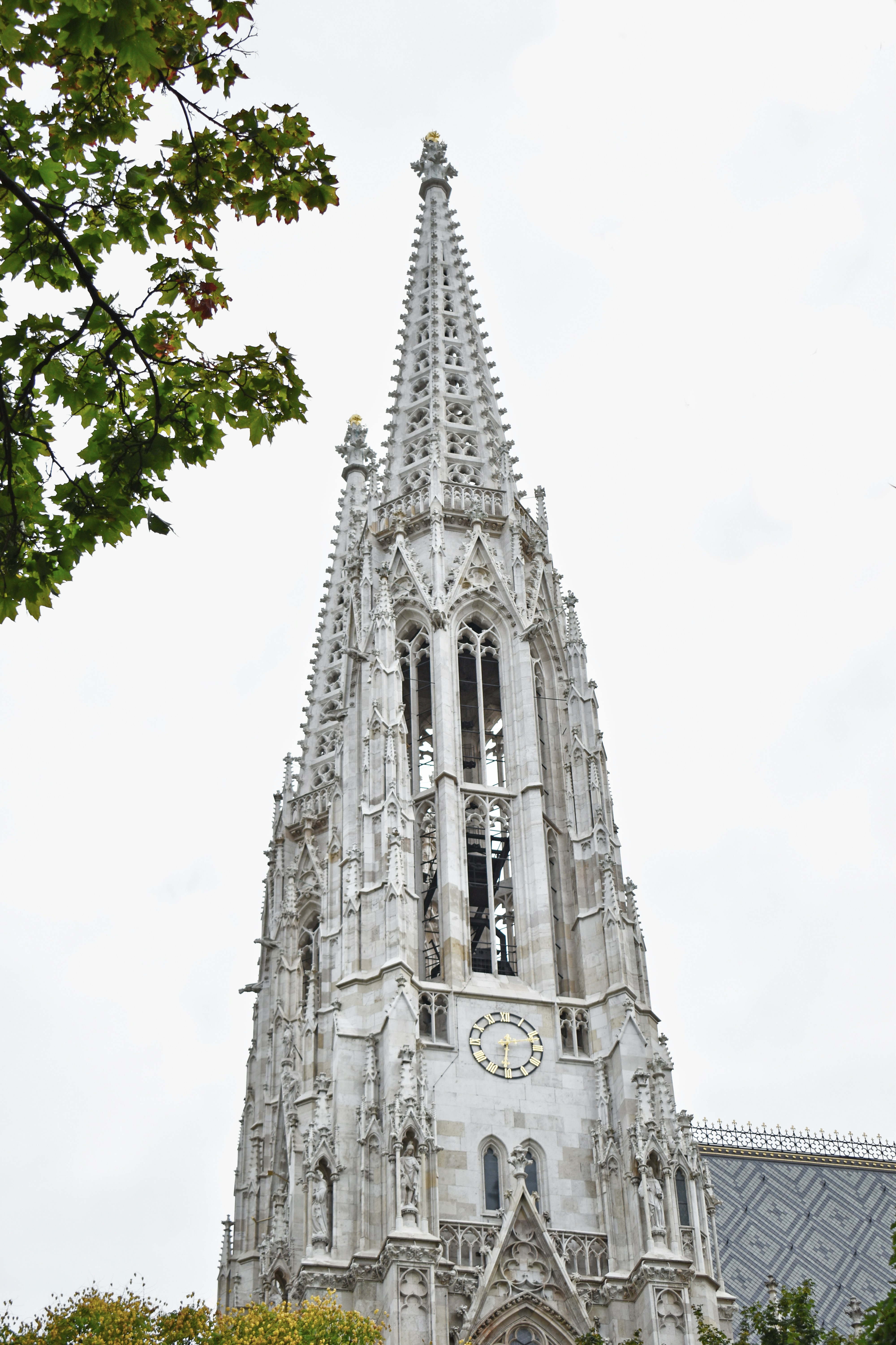 A very tall building with a clock on it's side