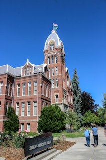 A large building with a flag on top of it