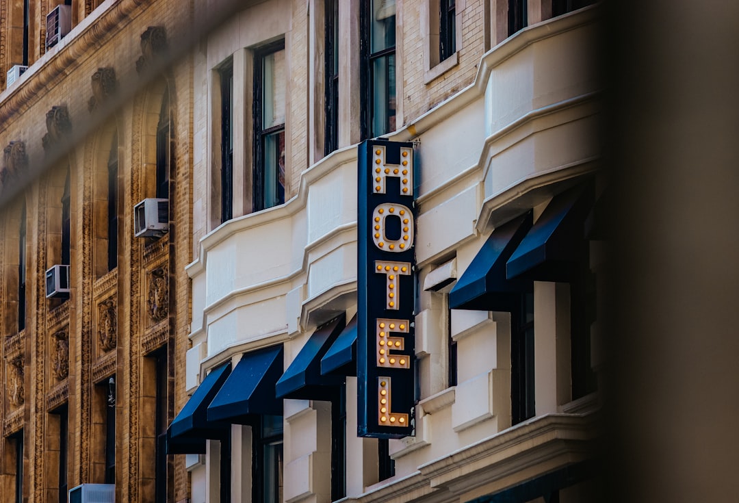 A hotel sign on the side of a building,