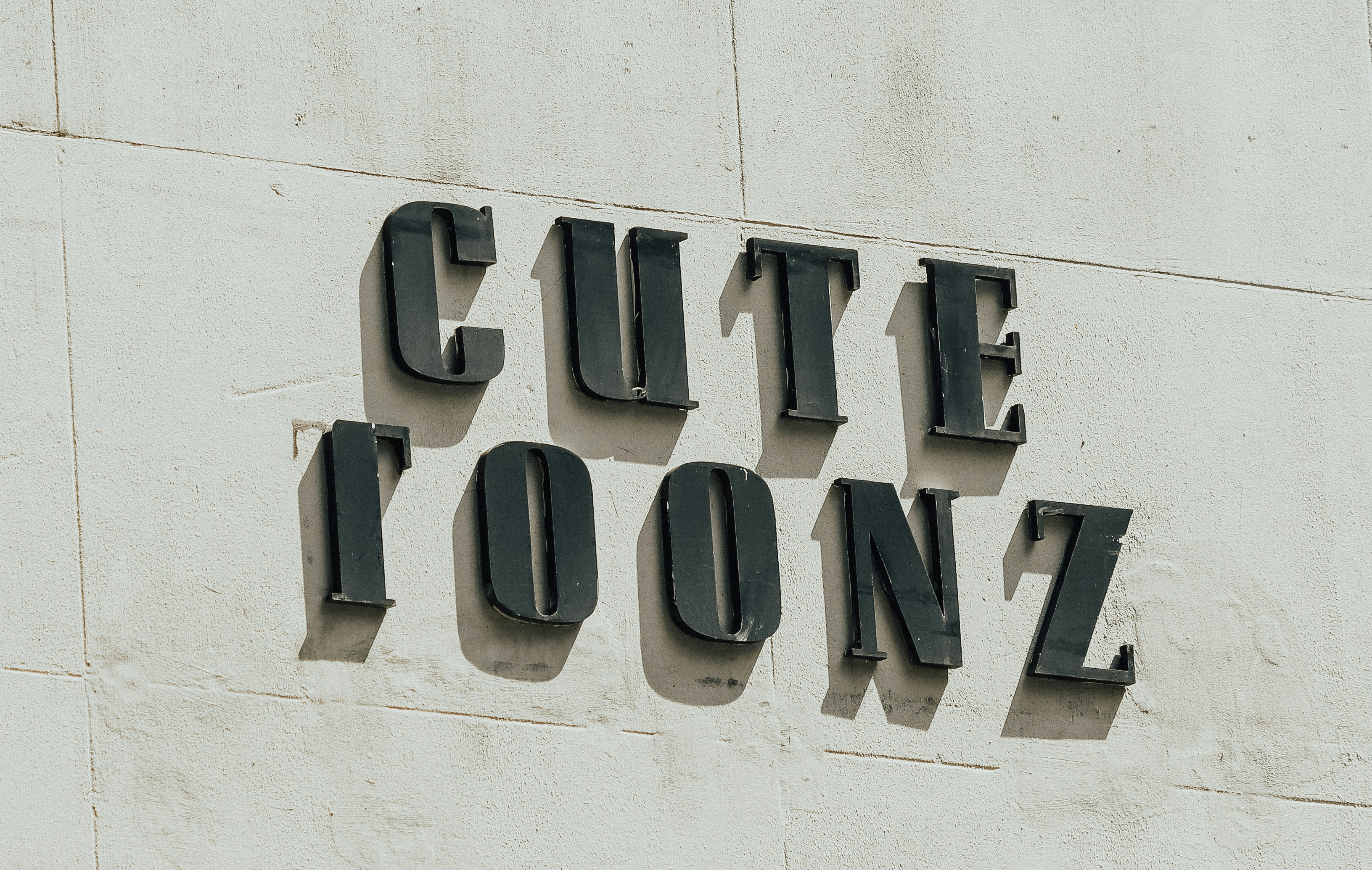 A close up of a sign on the side of a building