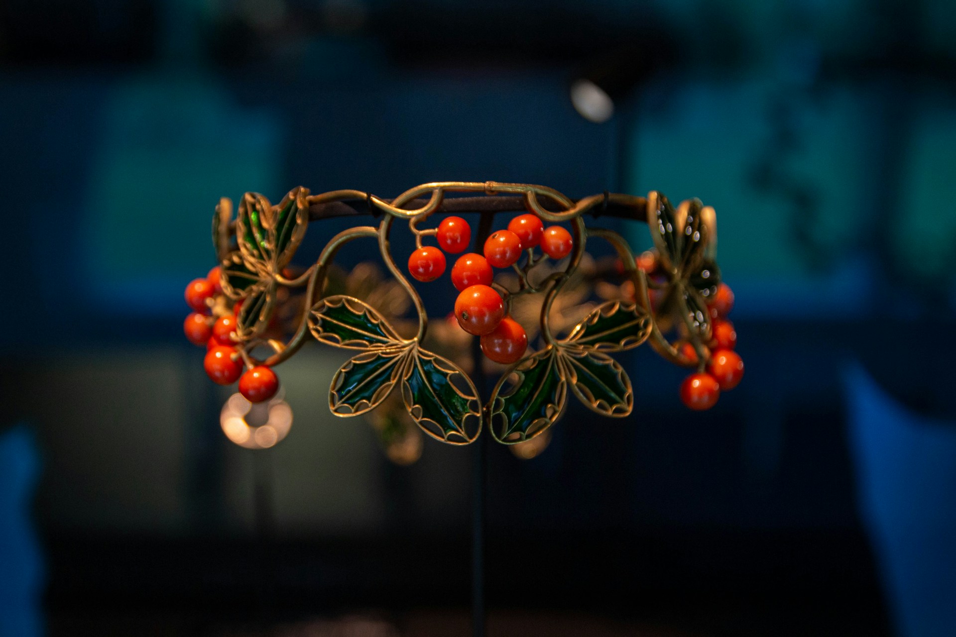 A tiara with berries and leaves on it