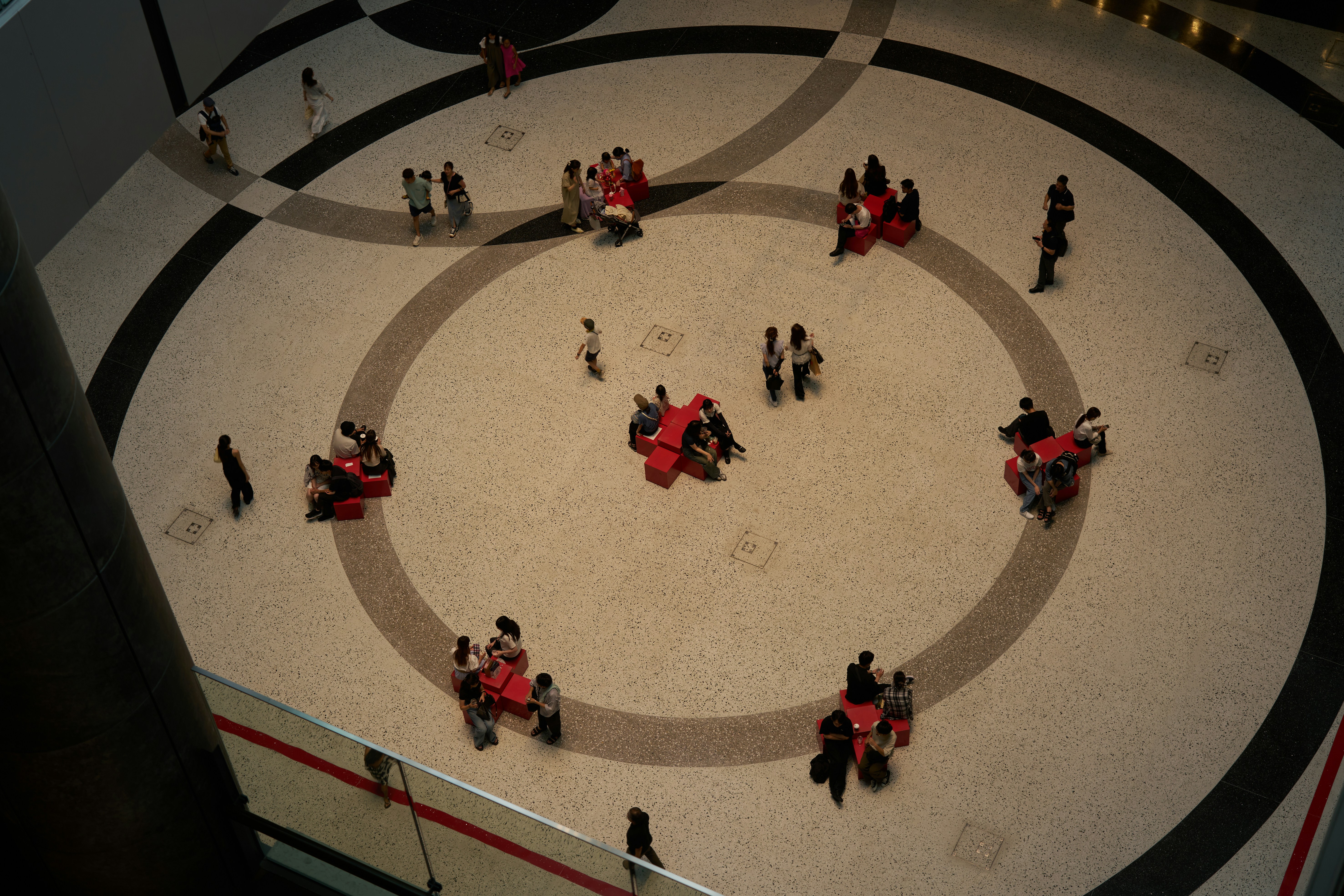 Group of people walking around building