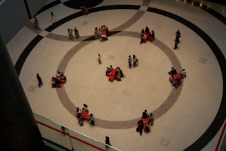 A group of people walking around a building