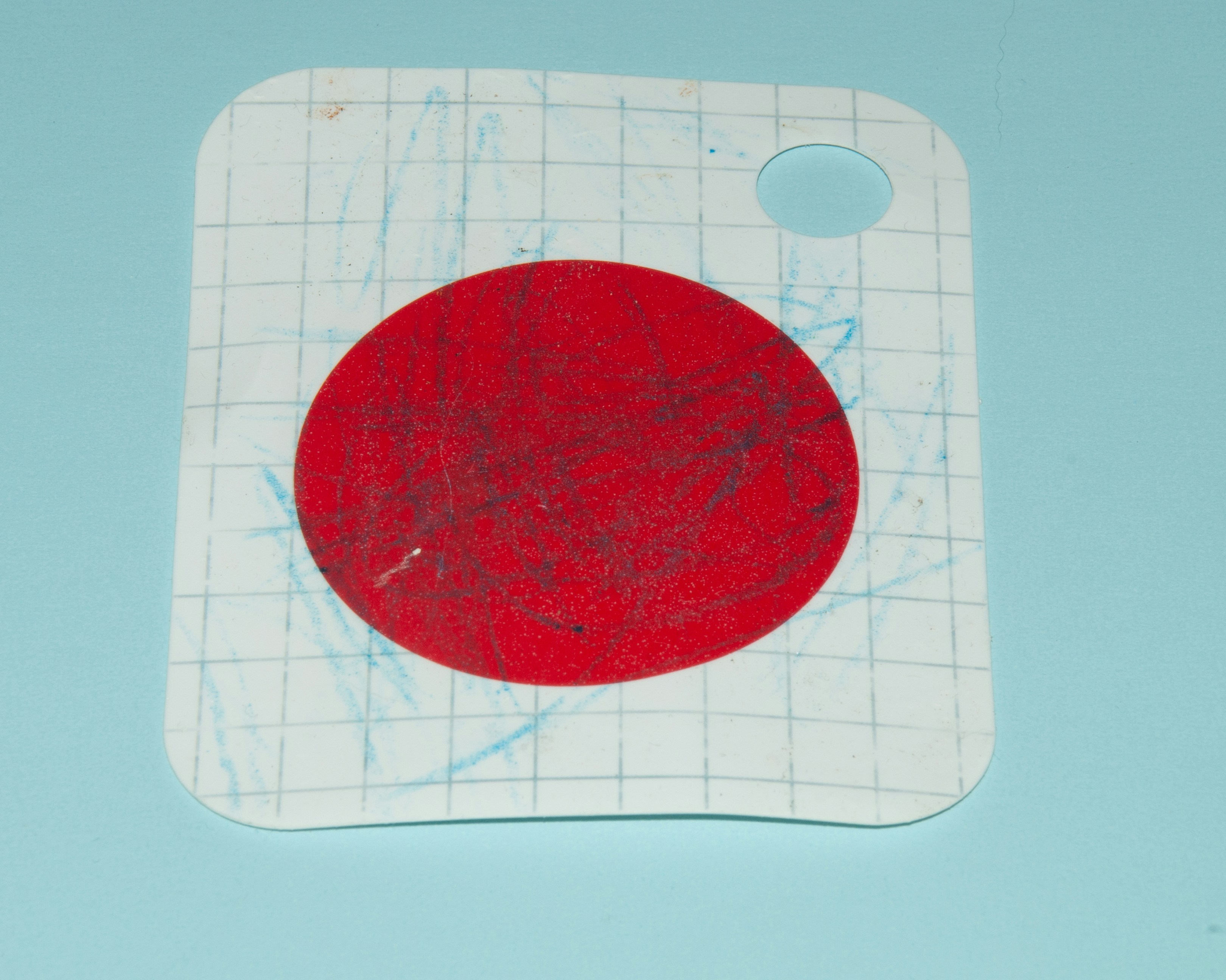 A piece of paper with a red circle on it