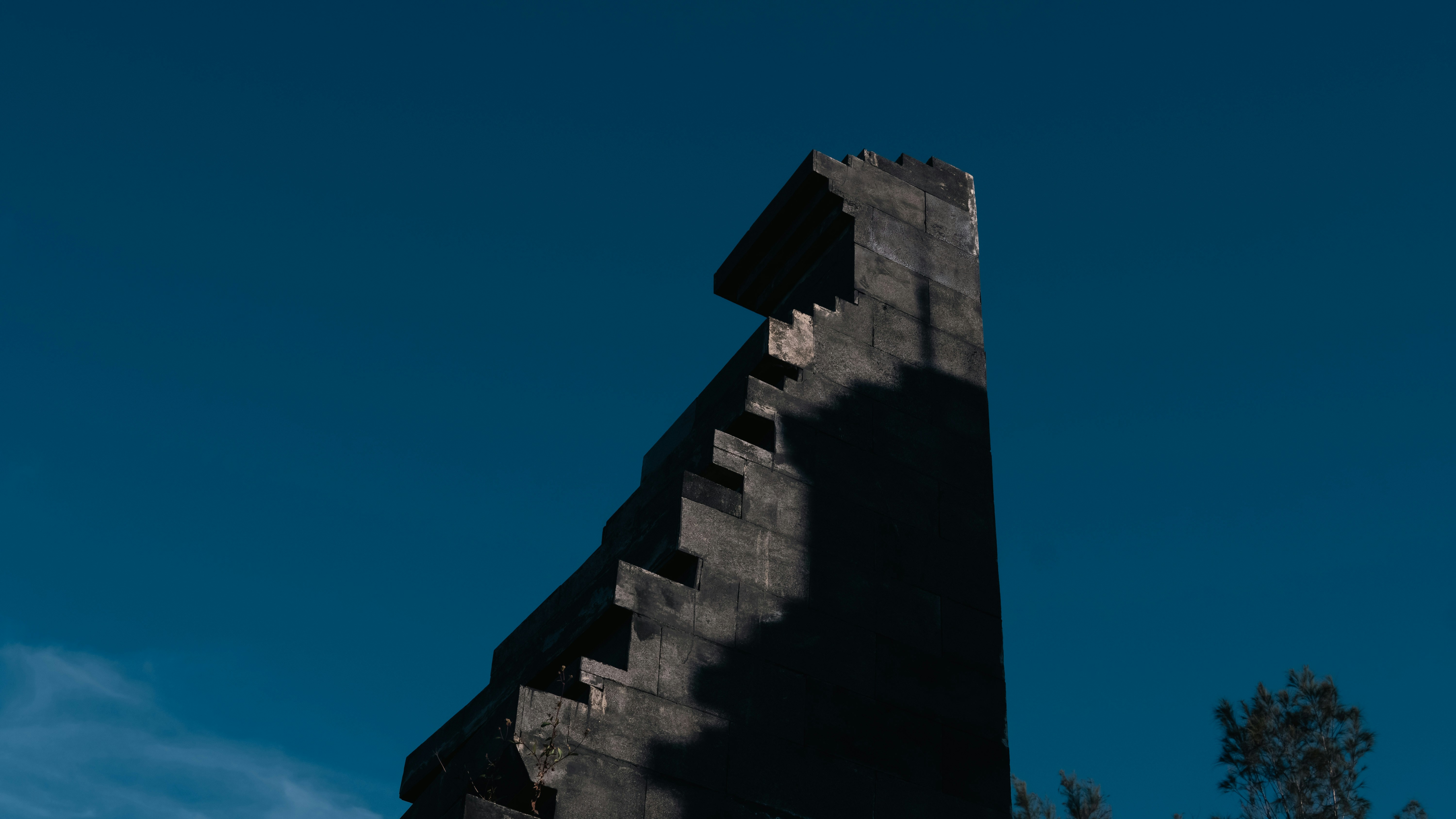 A clock tower with a blue sky in the background
