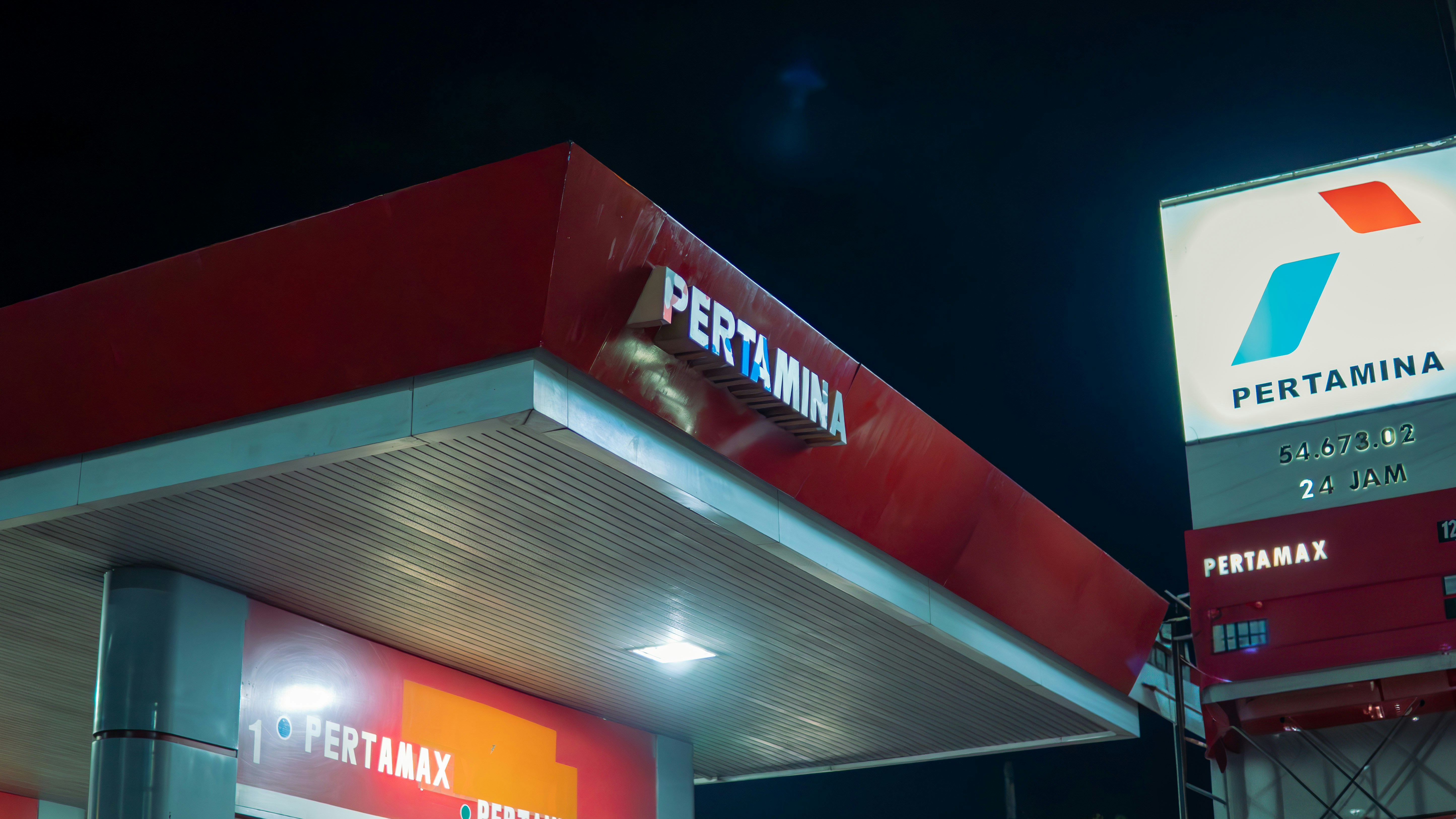 A gas station is lit up at night