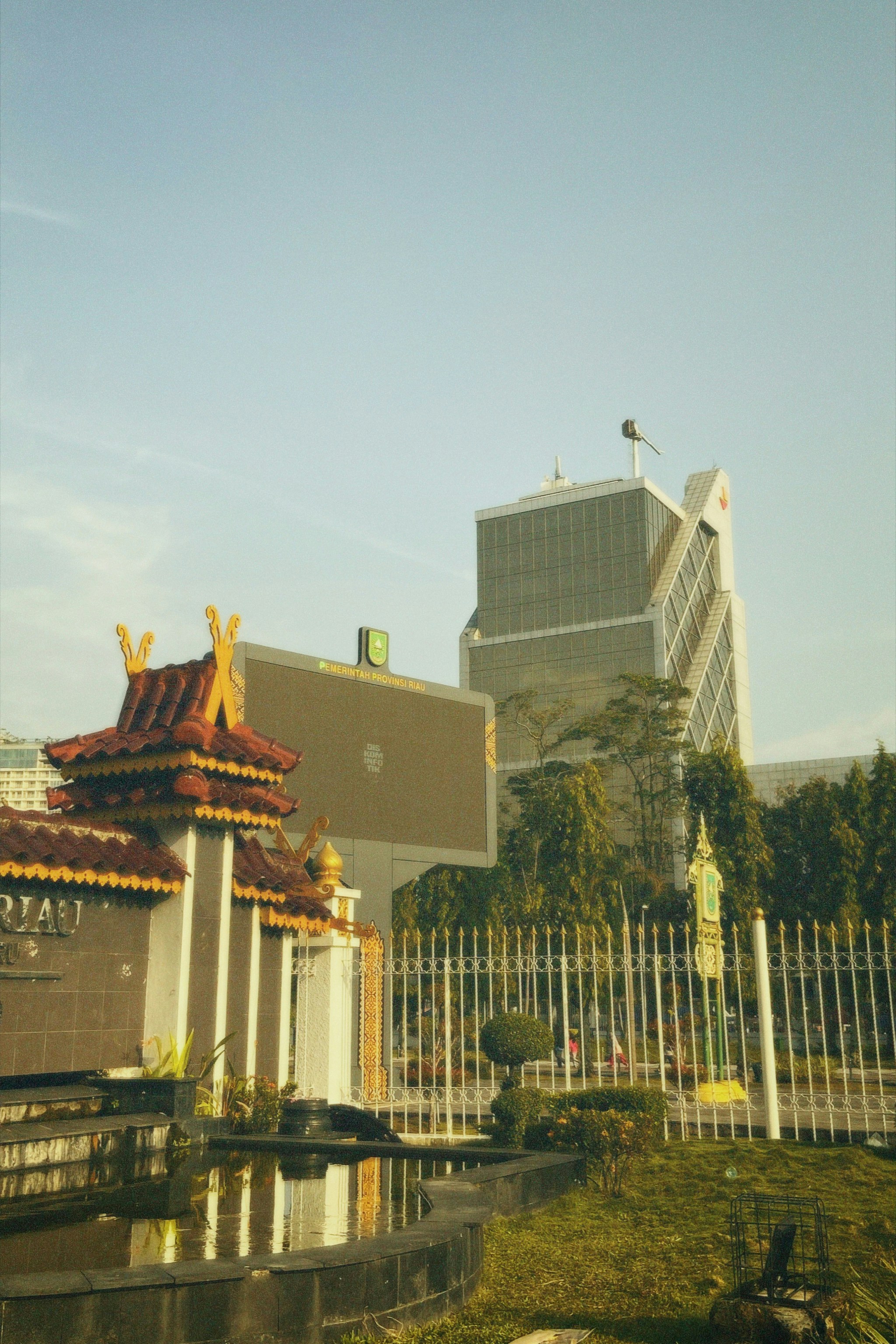 A tall building with a white fence around it