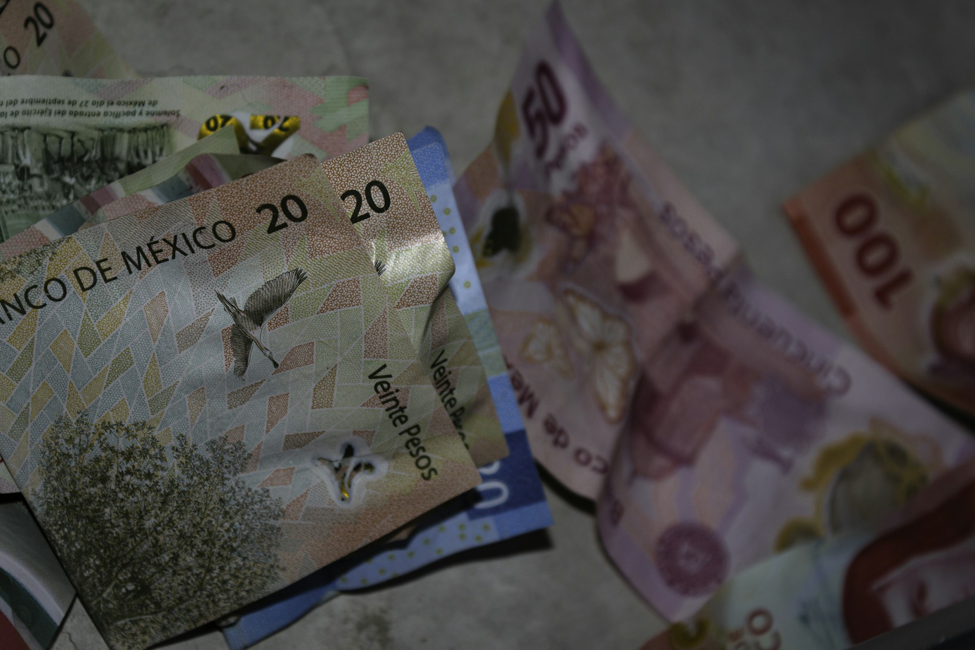 A pile of money sitting on top of a table