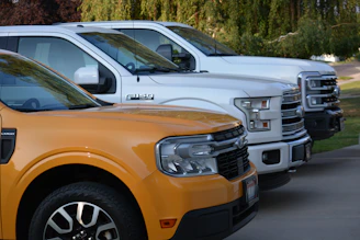 A row of trucks parked next to each other